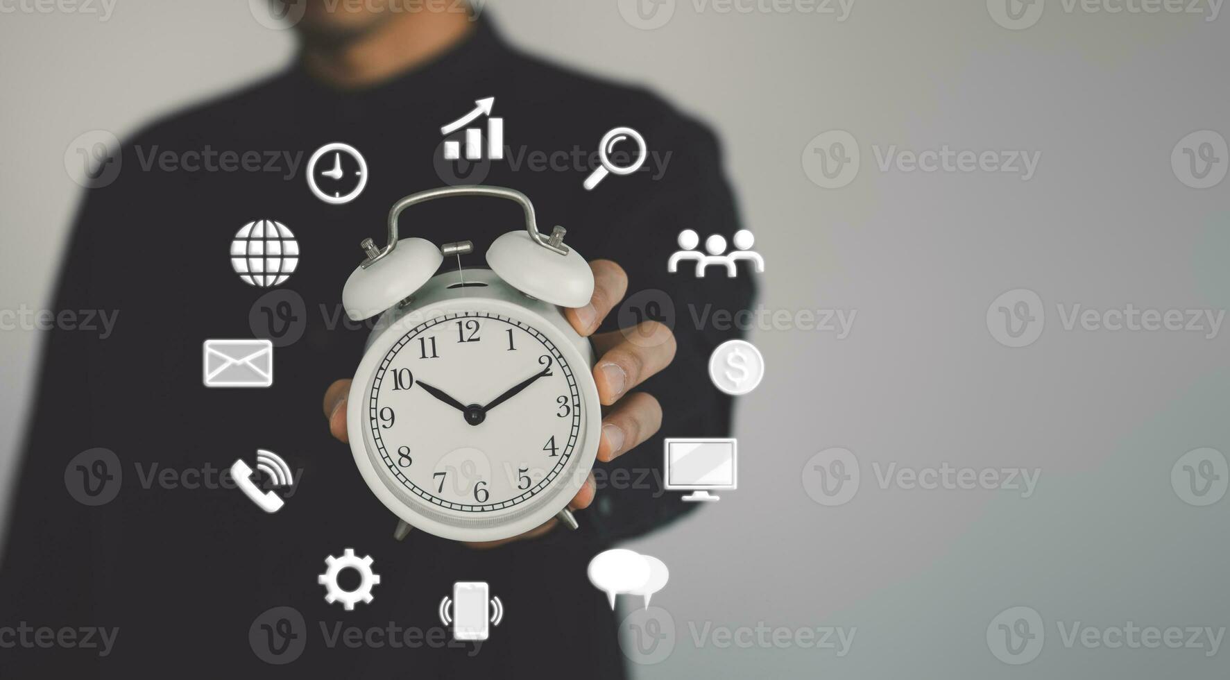 Time managment concept. Business man hold the clock and the icon. Work management. photo