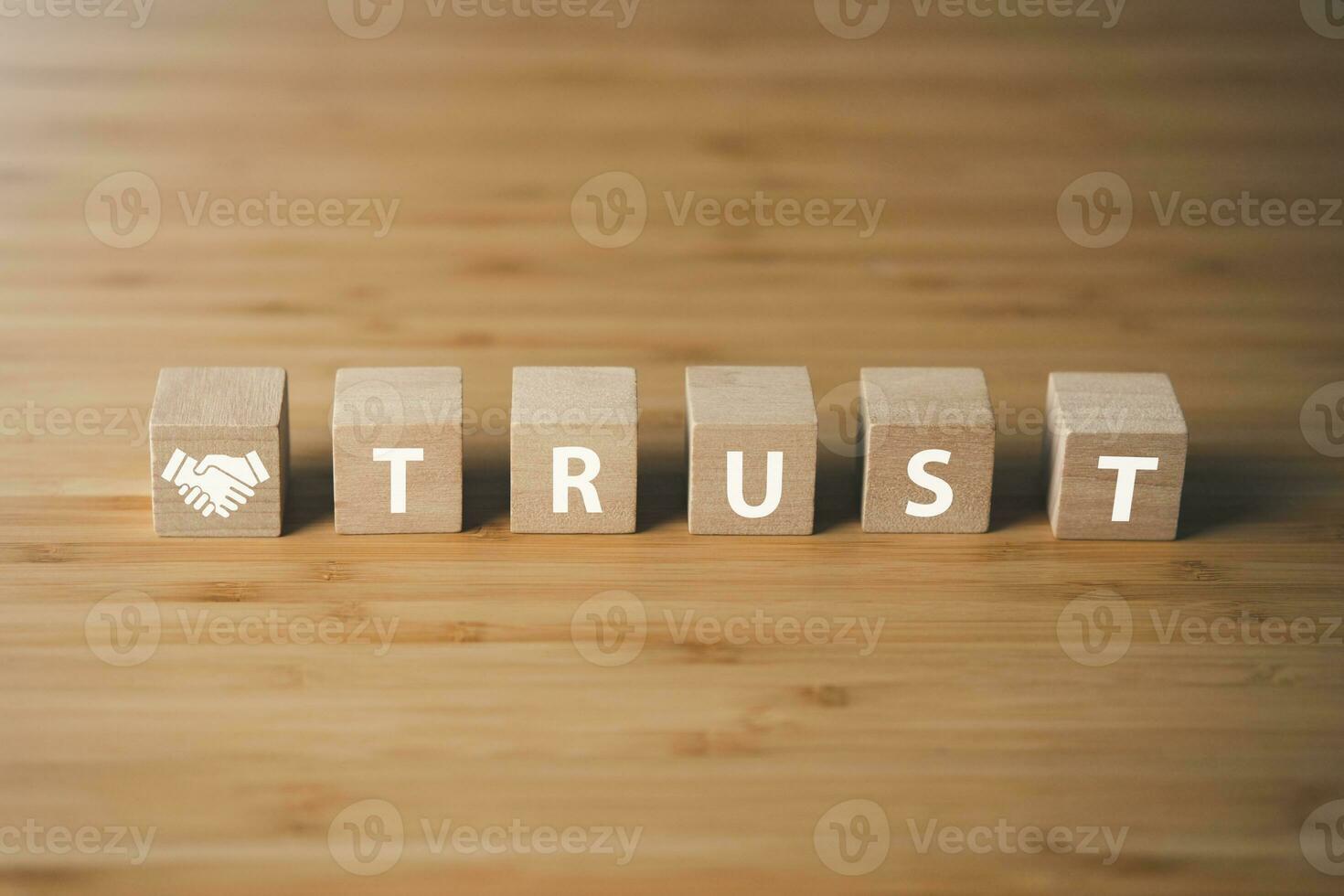 Wooden block of trust.businees achievement goal , business connection and team work concept. photo