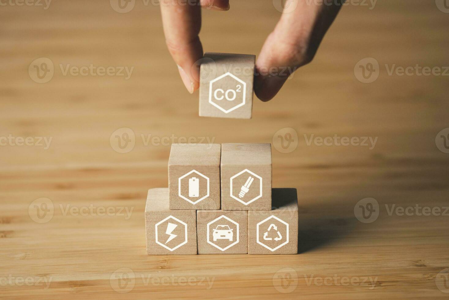 Wooden block of CO2 emission reduction icons. environment, global warming, CO2, sustainable energy concept. photo