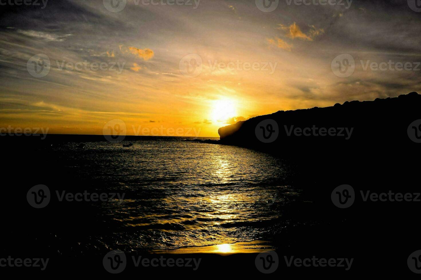 Sunset over the ocean photo