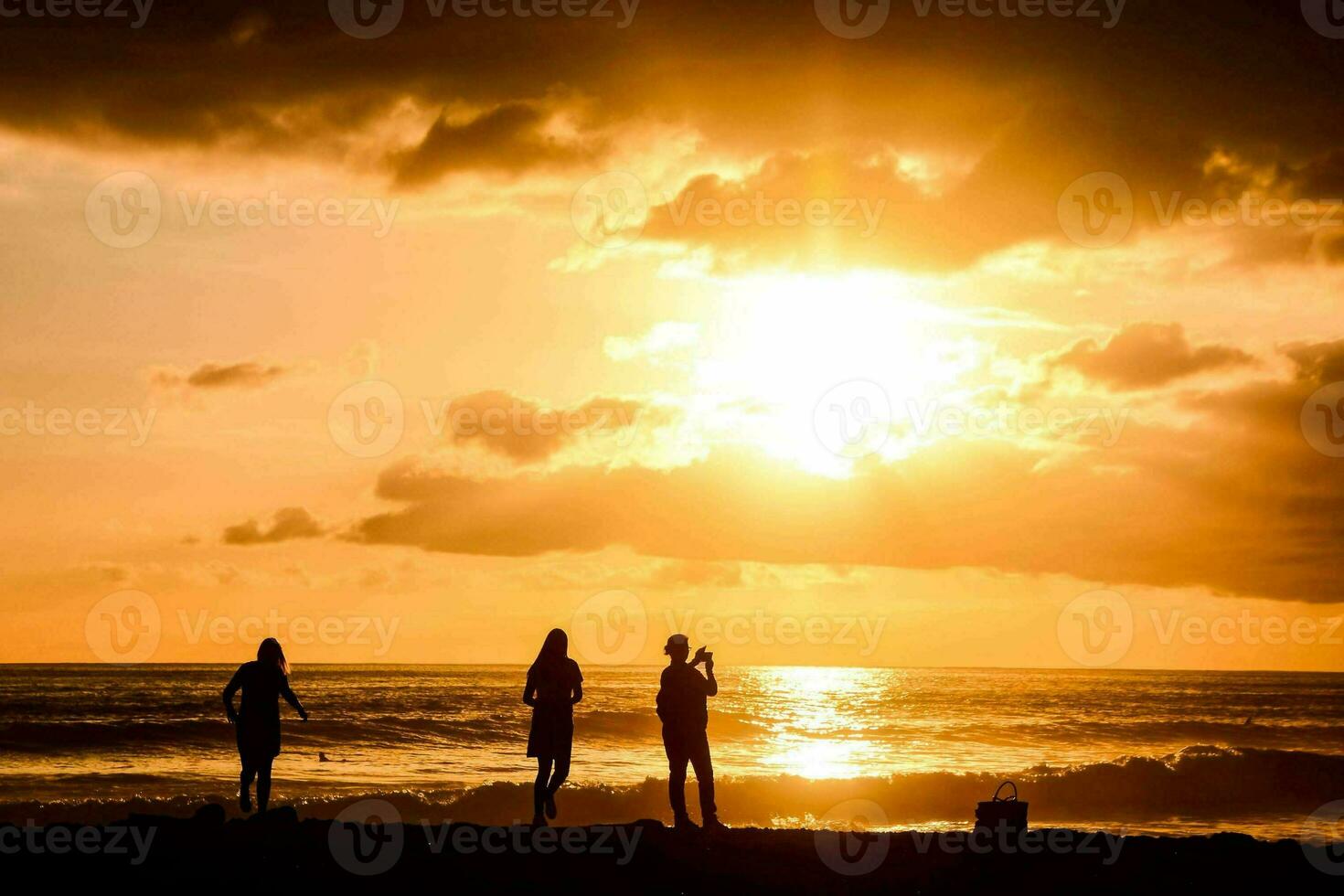 Landscape with silhouettes of people photo