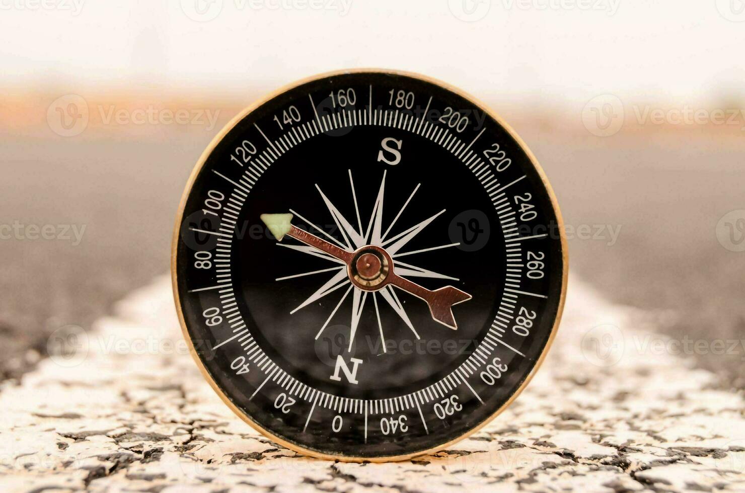 Compass  on the road photo