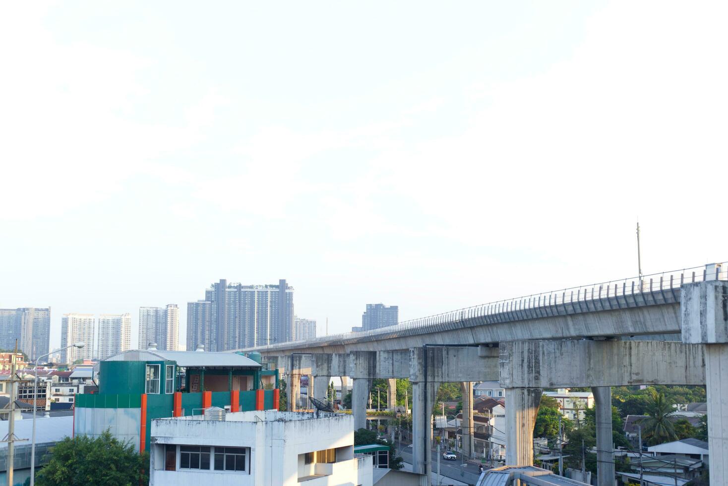 no clouds sky and the city building below background photo