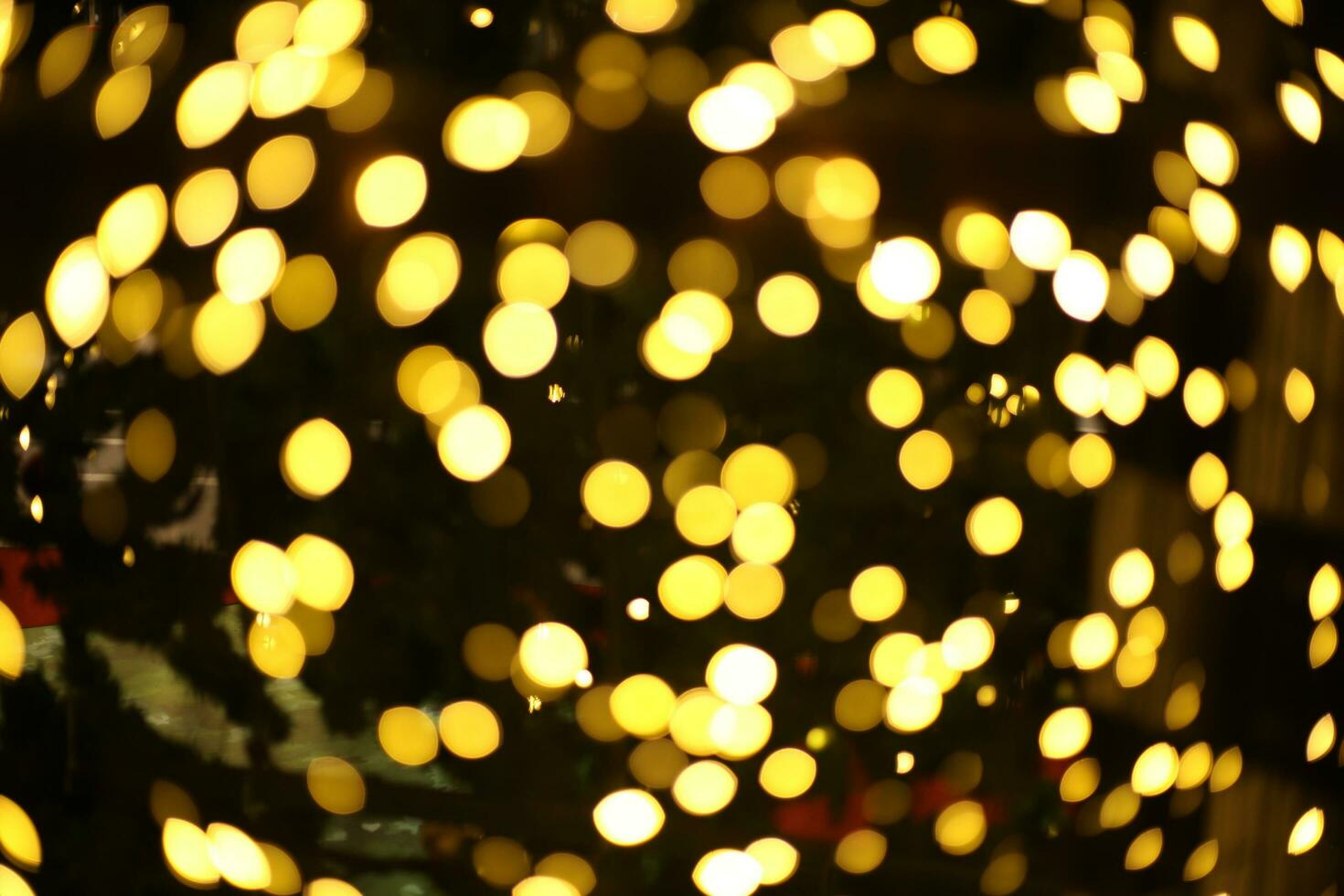blur bokeh circus tube lamp hang from ceiling in dark room like firefly photo