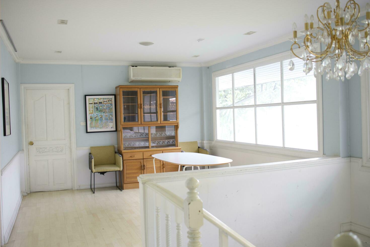 upper floor white house with vintage style decoration and stair photo