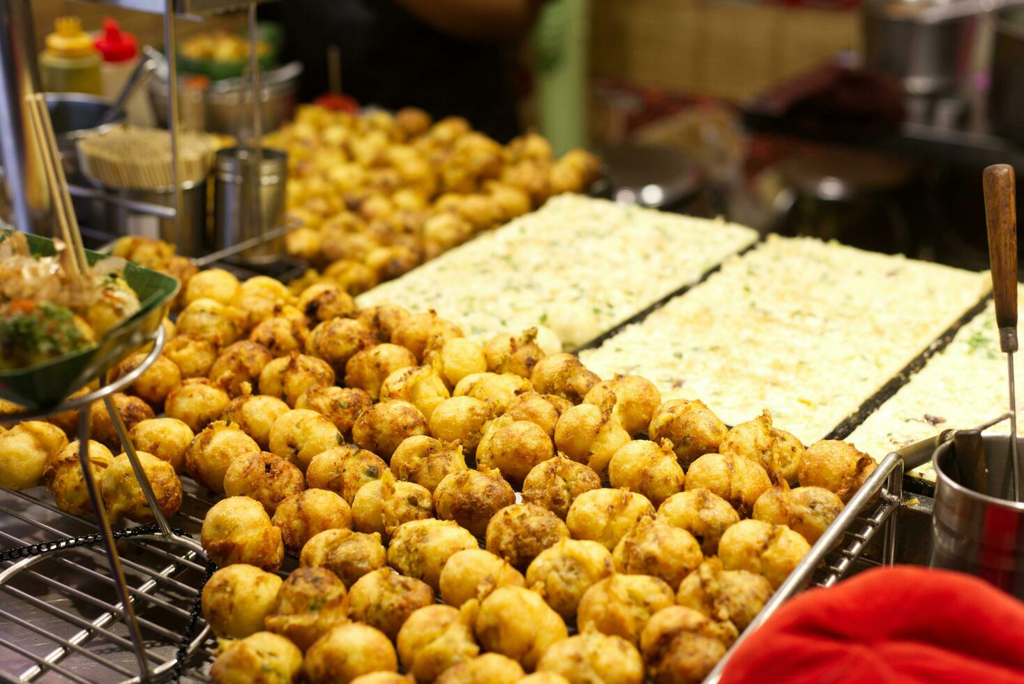 takoyaki making in streets market photo