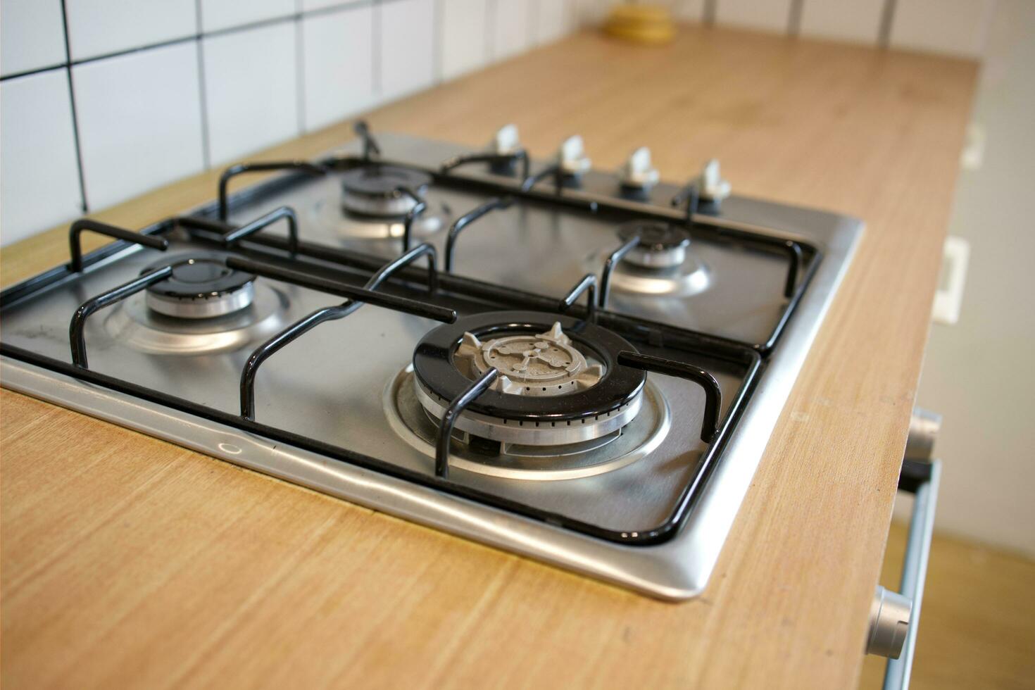 mock up gas stove in the minimal style kitchen with white and brown color photo