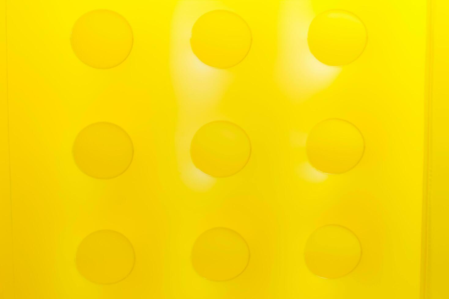 yellow block with the  rubber inflatable photo