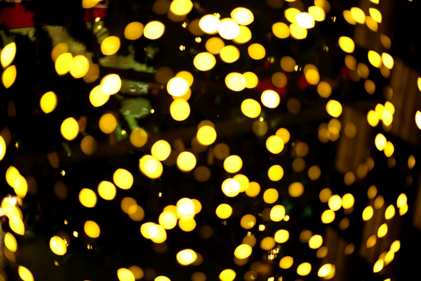 blur bokeh circus tube lamp hang from ceiling in dark room like firefly photo