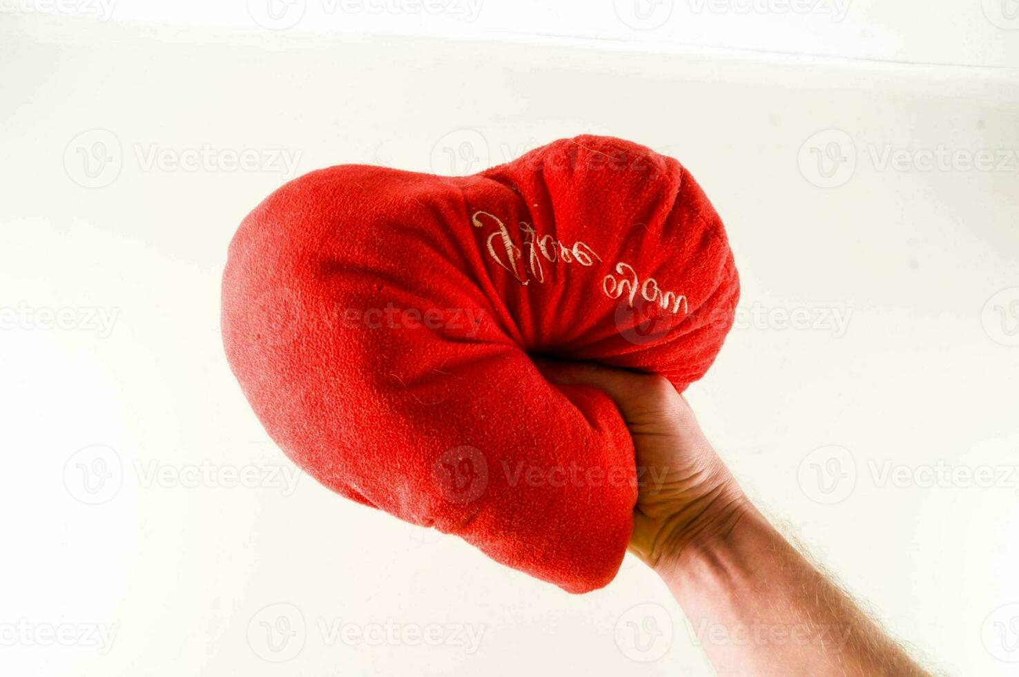 Heart pillow on white background photo