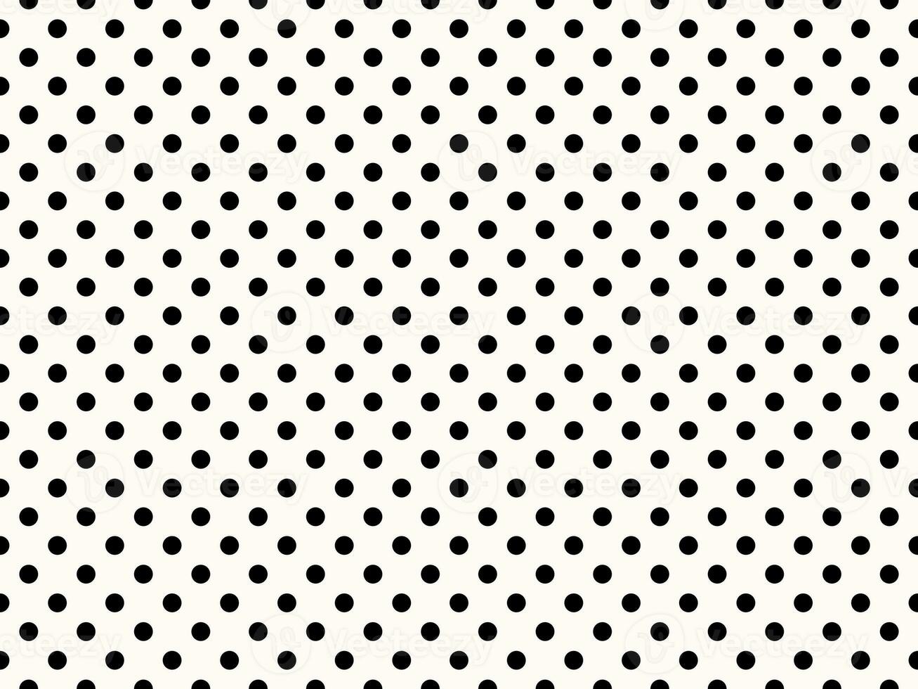 black polka dots over snow background photo