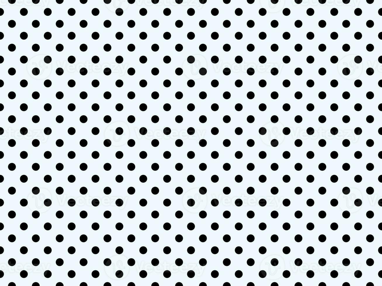 black polka dots over alice blue background photo