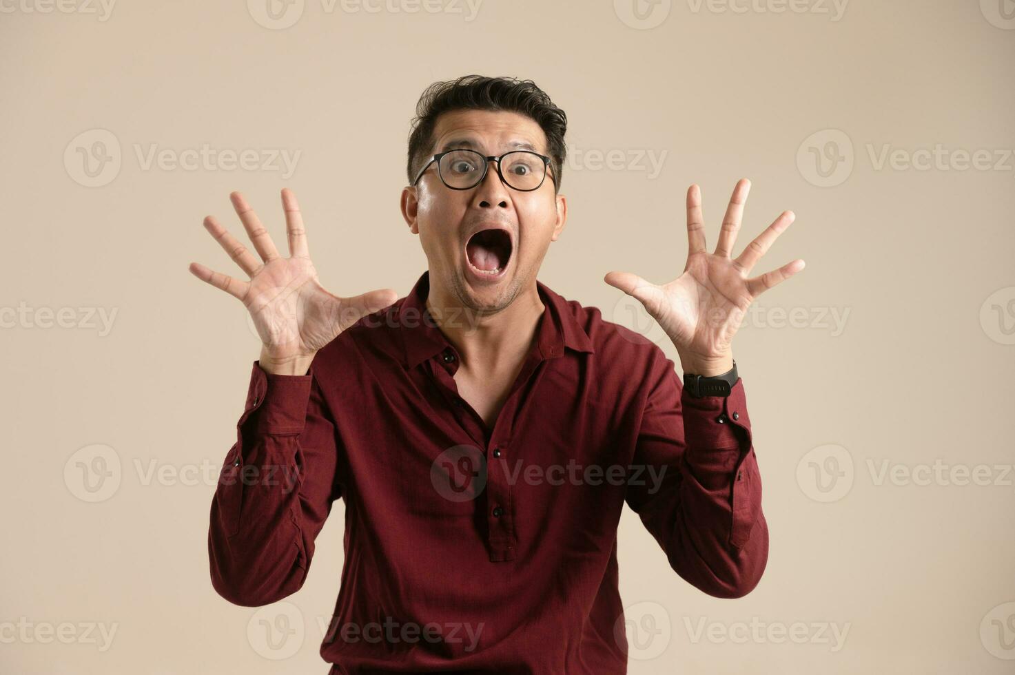Cheerful young asian man isolated on yellow background, presentation concept, young asian businessman smiling with arms crossed in isolated background photo