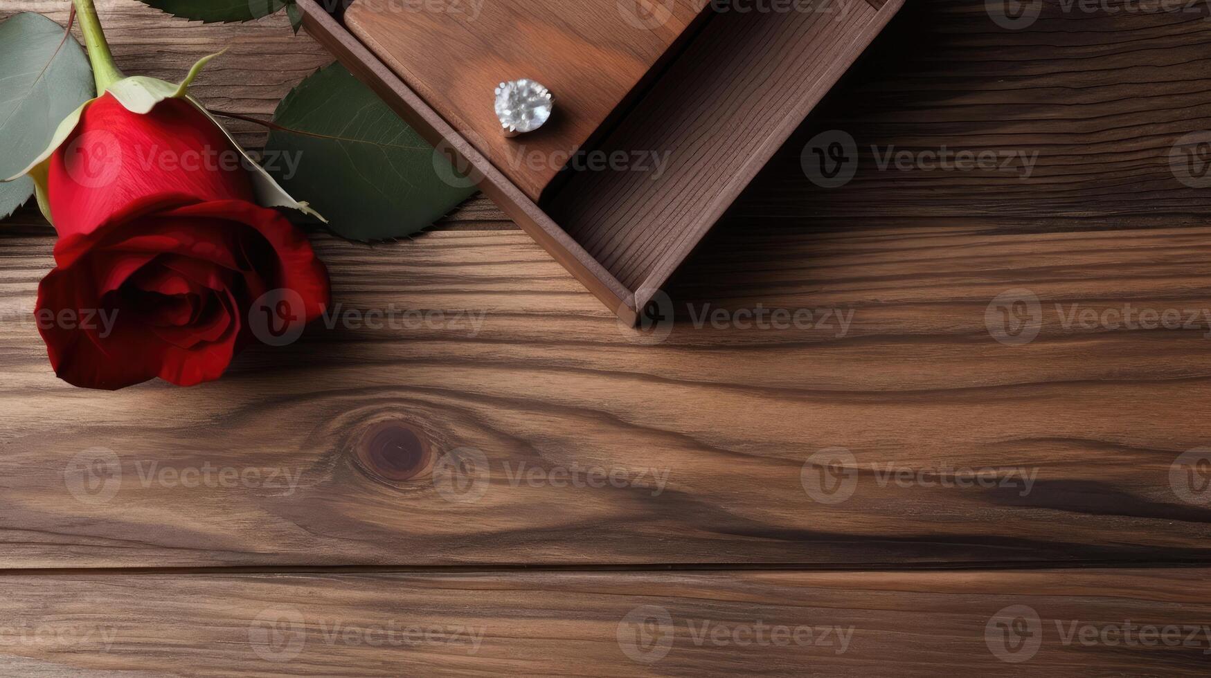 Diamond Ring on Wooden Box and Red Rose Flower on Plank Texture Table Top. . photo