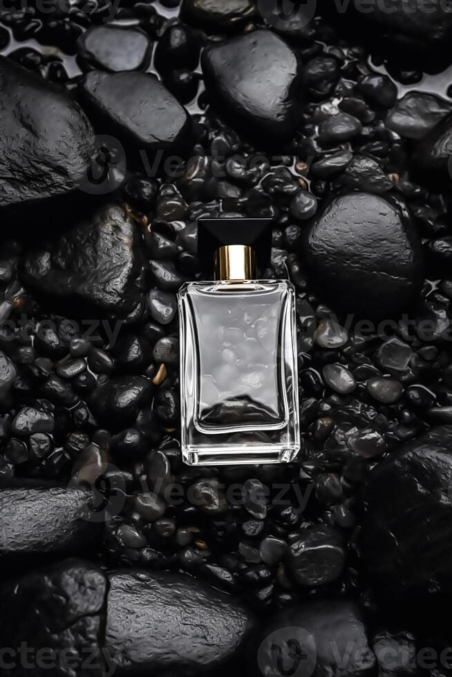 Modern glass men perfume bottle among black rocks in the rain, fragrance and perfumery, post-processed, photo