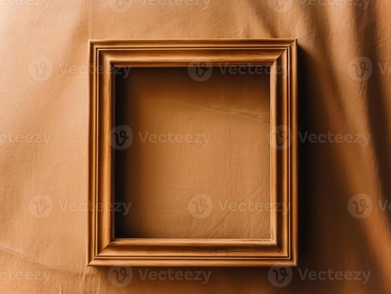 Minimalistic empty wooden frame on brown fabric backdrop for painting, poster, photo or artwork wall art mockup, home decor and interior design.