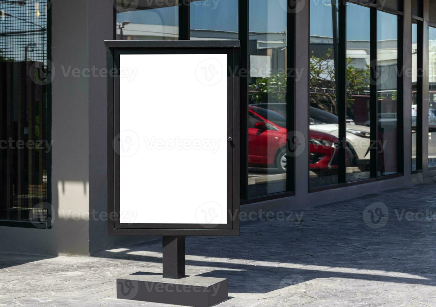 Outdoor pole LED display billboard with mock up white screen on footpath. clipping path for mockup photo