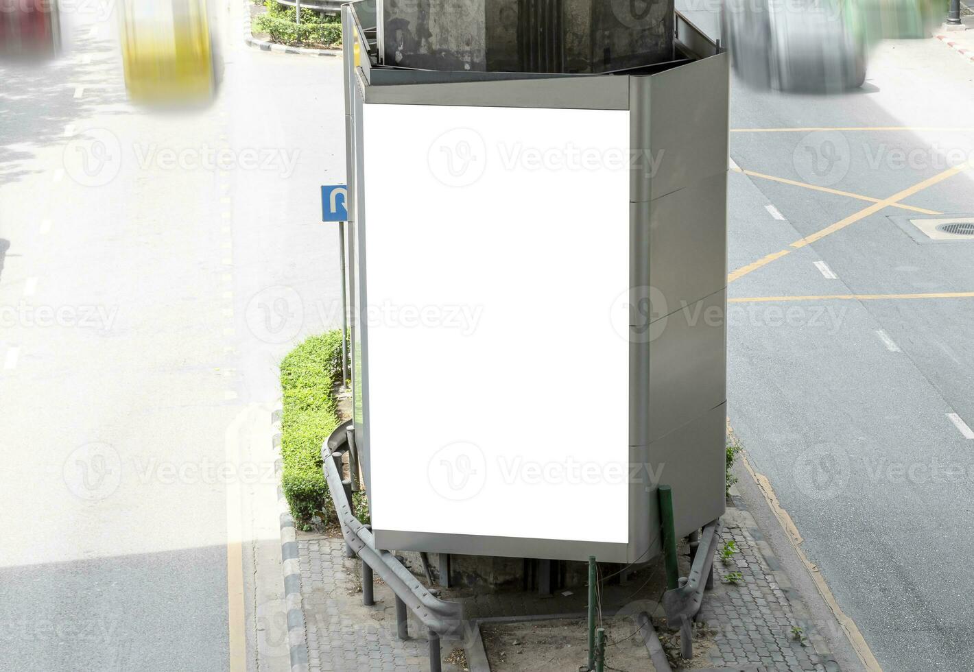 Outdoor pole LED display billboard with mock up white screen on footpath. clipping path for mockup photo