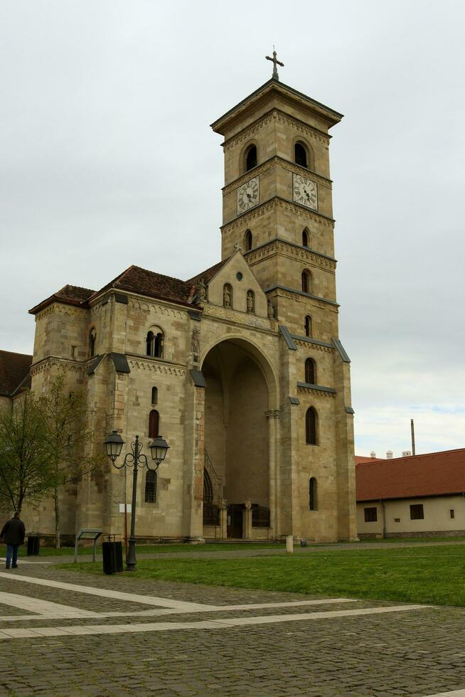 Saint Michael's Roman Catholic Cathedral in Alba Iulia immortalized from different angles photo