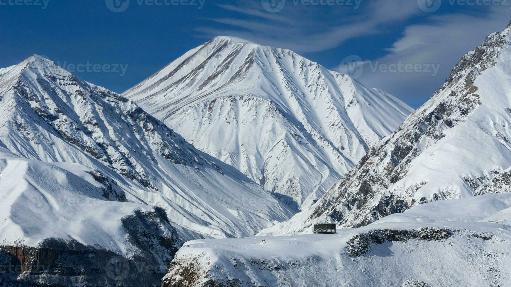 View of Caucasian Mountain in winter. Cross Pass in Georgia. Gudauri District. Source of Aragvi River photo