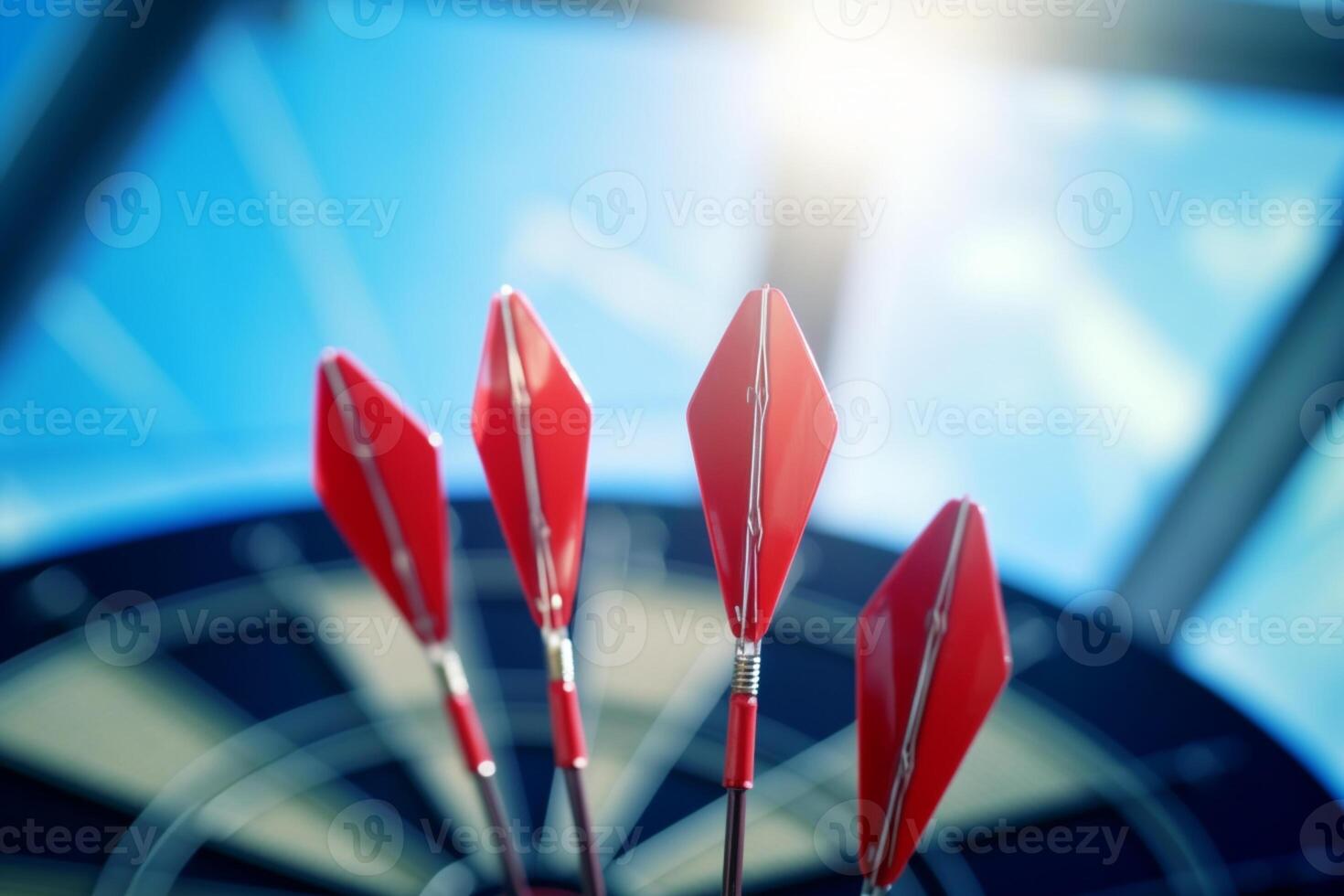 A close-up shot of a red dart in the center of a dartboard target. photo