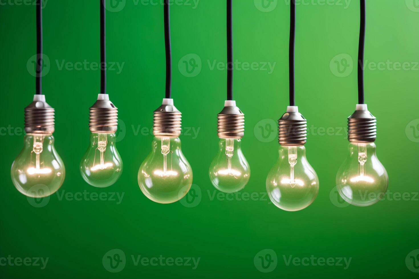 Idea concept on light bulb hanging on green background, photo