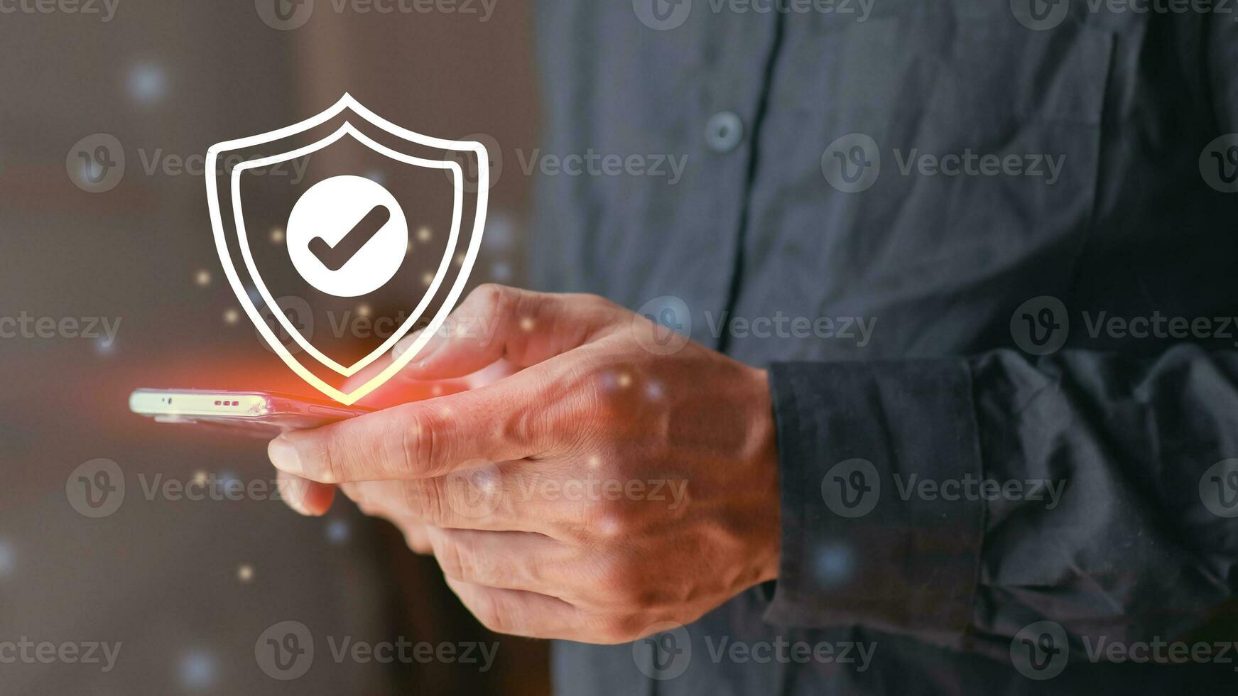 Man holding protective shield icon. Protection of telephone network security and data security, cyber security and hazard protection. photo