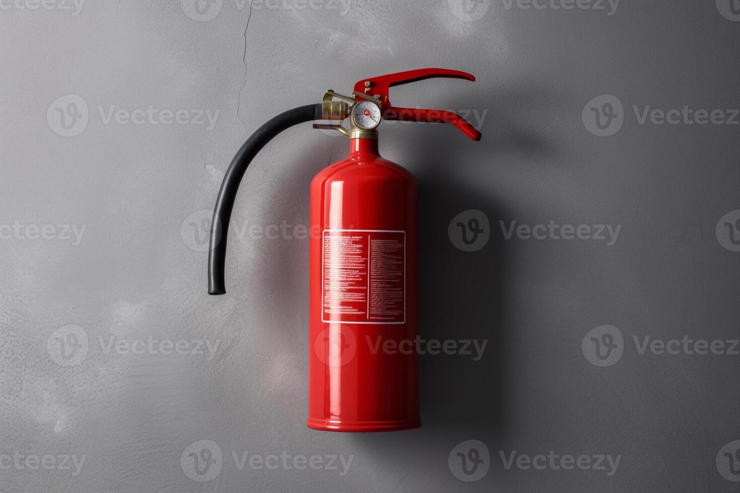 Fire extinguisher on gray wall, photo