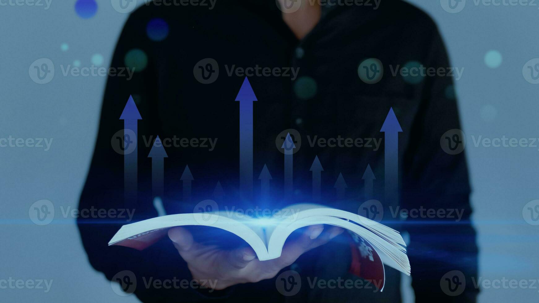 Open book with up arrow line icon. Man holding open book with grow arrow icon photo