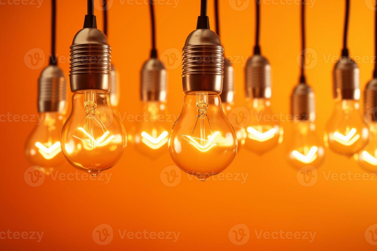 Idea concept on light bulb hanging on orange background, photo