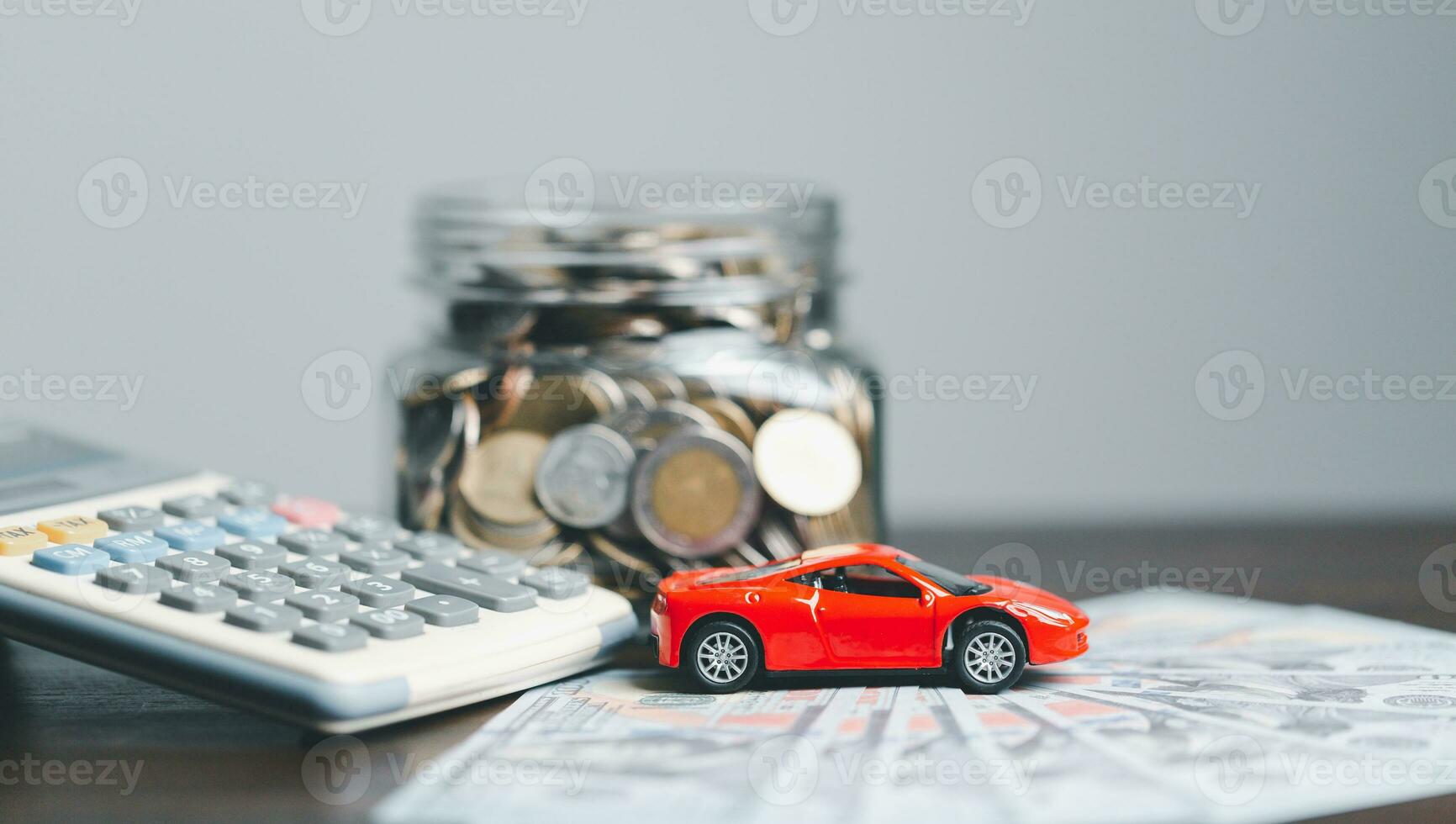 Car and house model with coins and financial document on wooden table. Asset approval concepts purchases to buy a car and a house. Ideas for home buying checklist home loan tax photo