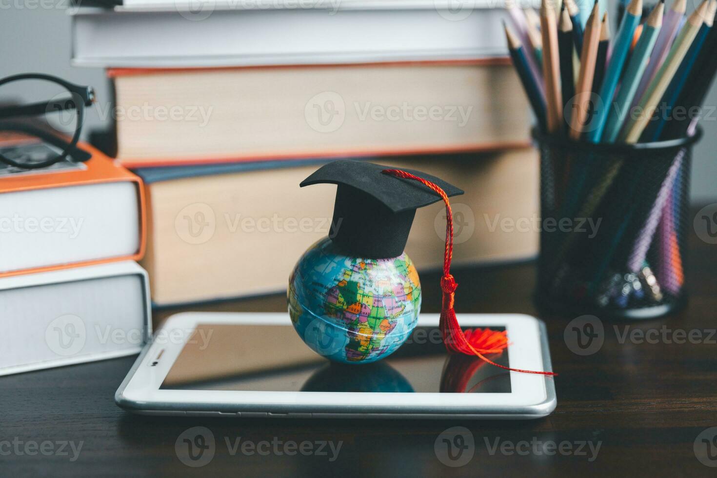 Graduation cap with Earth globe. Concept of global business study, abroad educational, Back to School. Education in Global world, Study abroad business in universities in worldwide. language study photo