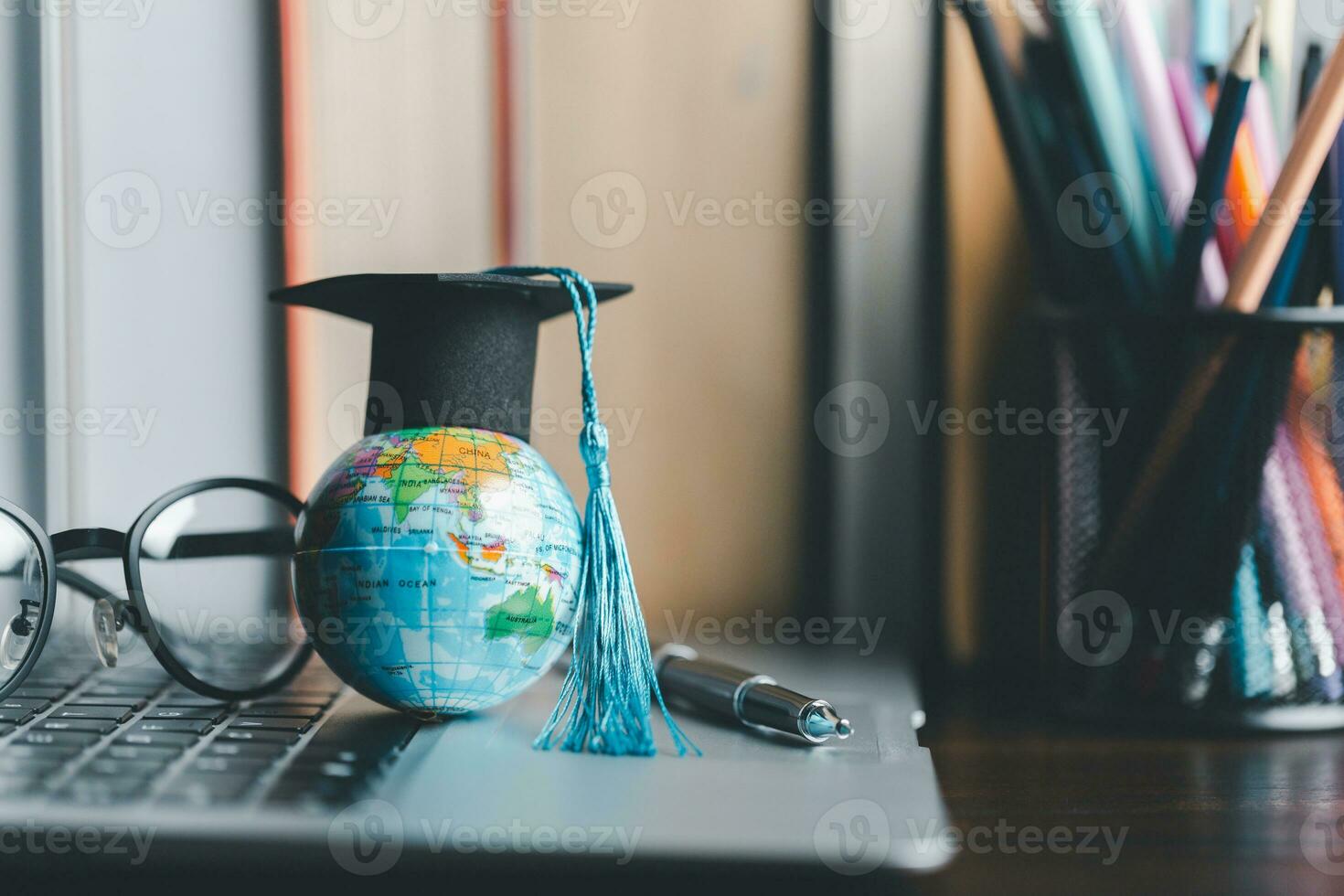 Graduation cap with Earth globe. Concept of global business study, abroad educational, Back to School. Education in Global world, Study abroad business in universities in worldwide. language study photo