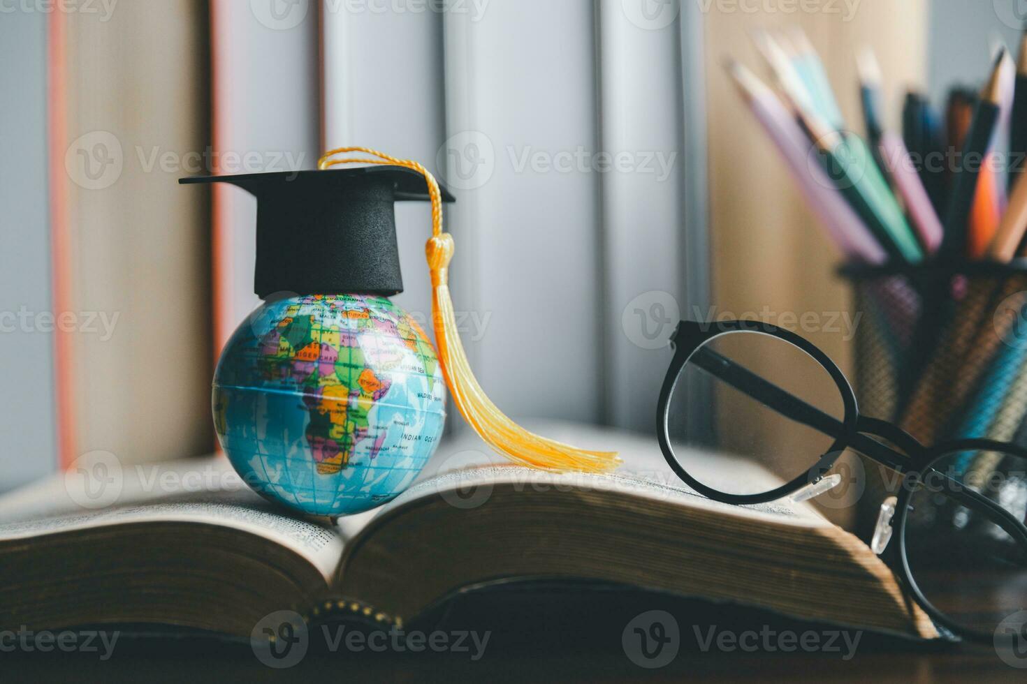 Graduation cap with Earth globe. Concept of global business study, abroad educational, Back to School. Education in Global world, Study abroad business in universities in worldwide. language study photo