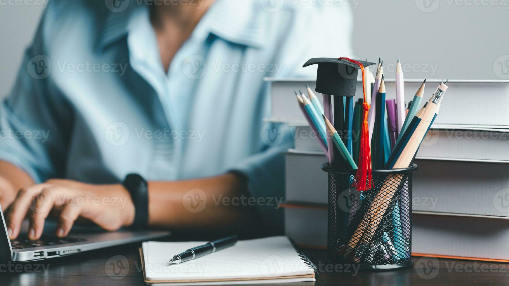 Education concept. Close up of female student make notes hand typing in laptop study online on computer from home. Woman typing in computer talking distant on webcam virtual zoom call on laptop. photo