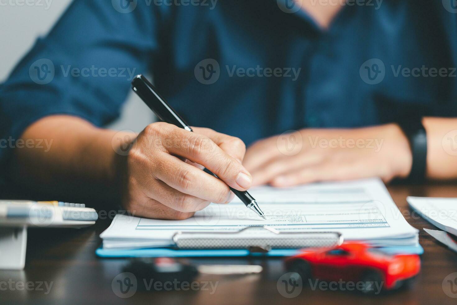 Businesswoman signing contract document. Rental contract, insurance, contract agreement. Asset approval concepts purchases to buy a car and a house. Ideas for home buying checklist home loan tax. photo