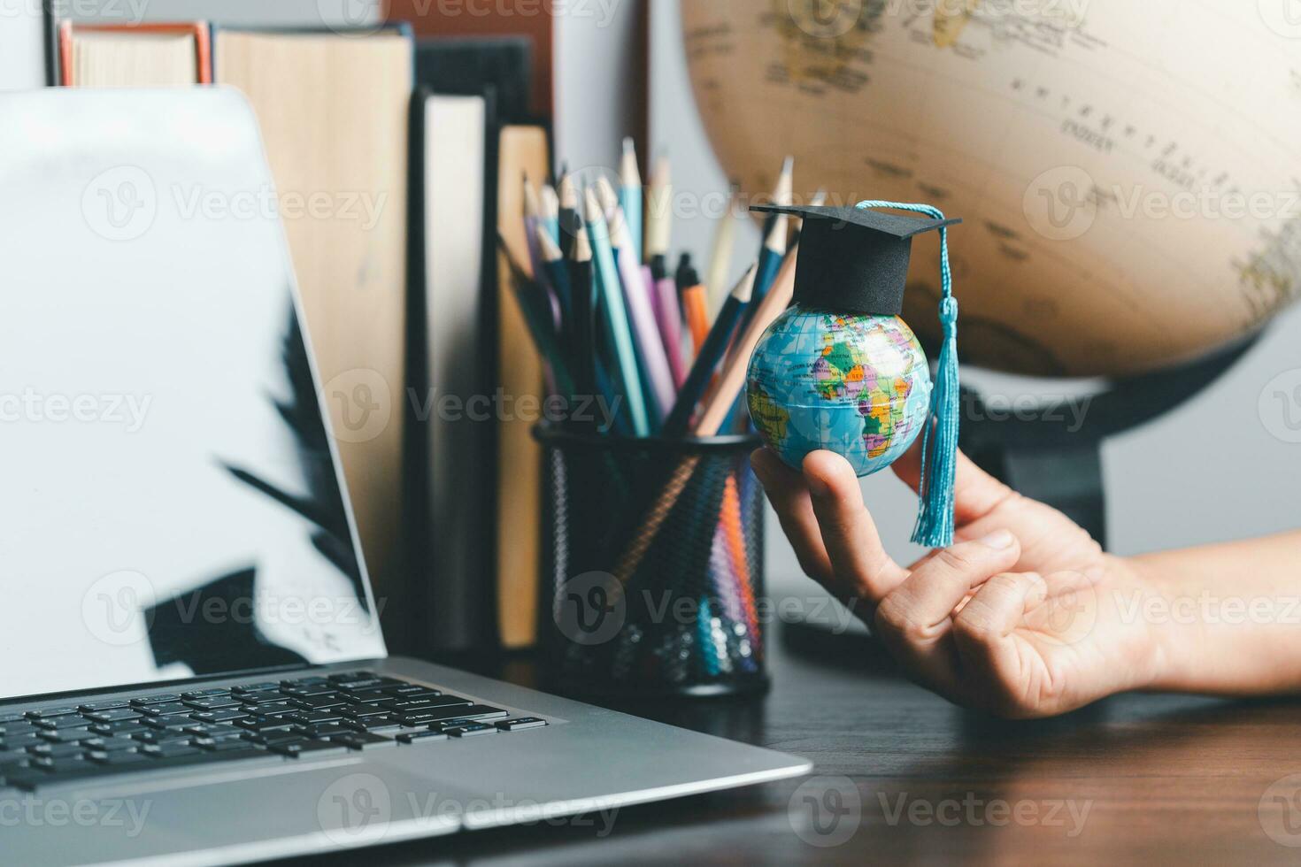 Graduation cap with Earth globe. Concept of global business study, abroad educational, Back to School. Education in Global world, Study abroad business in universities in worldwide. language study photo
