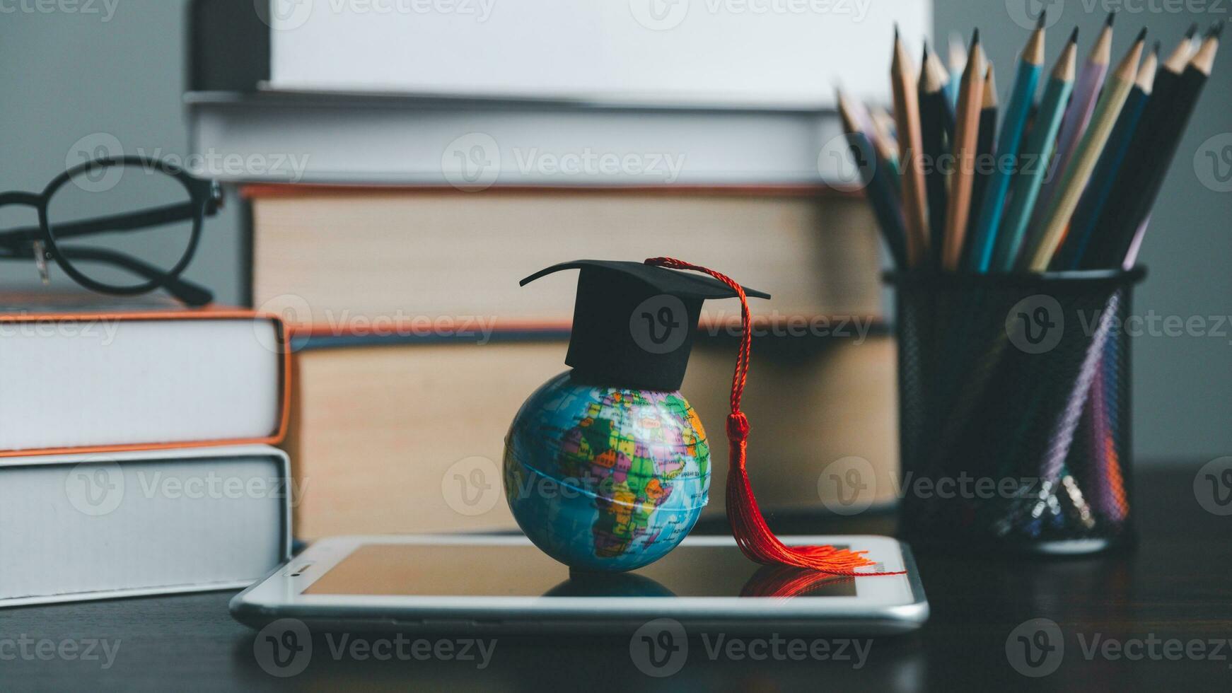 Graduation cap with Earth globe. Concept of global business study, abroad educational, Back to School. Education in Global world, Study abroad business in universities in worldwide. language study photo