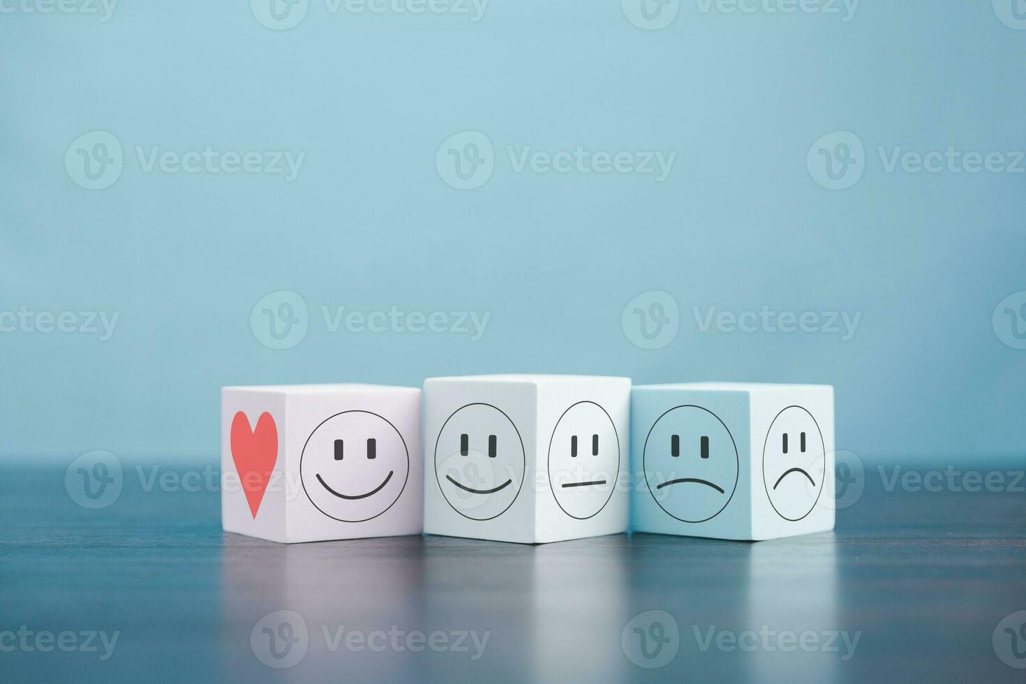 Happy face smile face icon on cube object. Customer experience and service with satisfaction concept. positive thinking, mental health assessment, world mental health day. photo