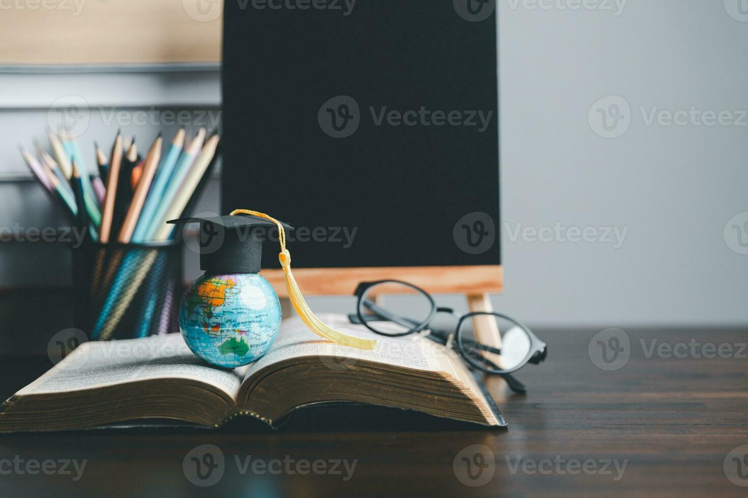 Graduation cap with Earth globe. Concept of global business study, abroad educational, Back to School. Education in Global world, Study abroad business in universities in worldwide. language study photo