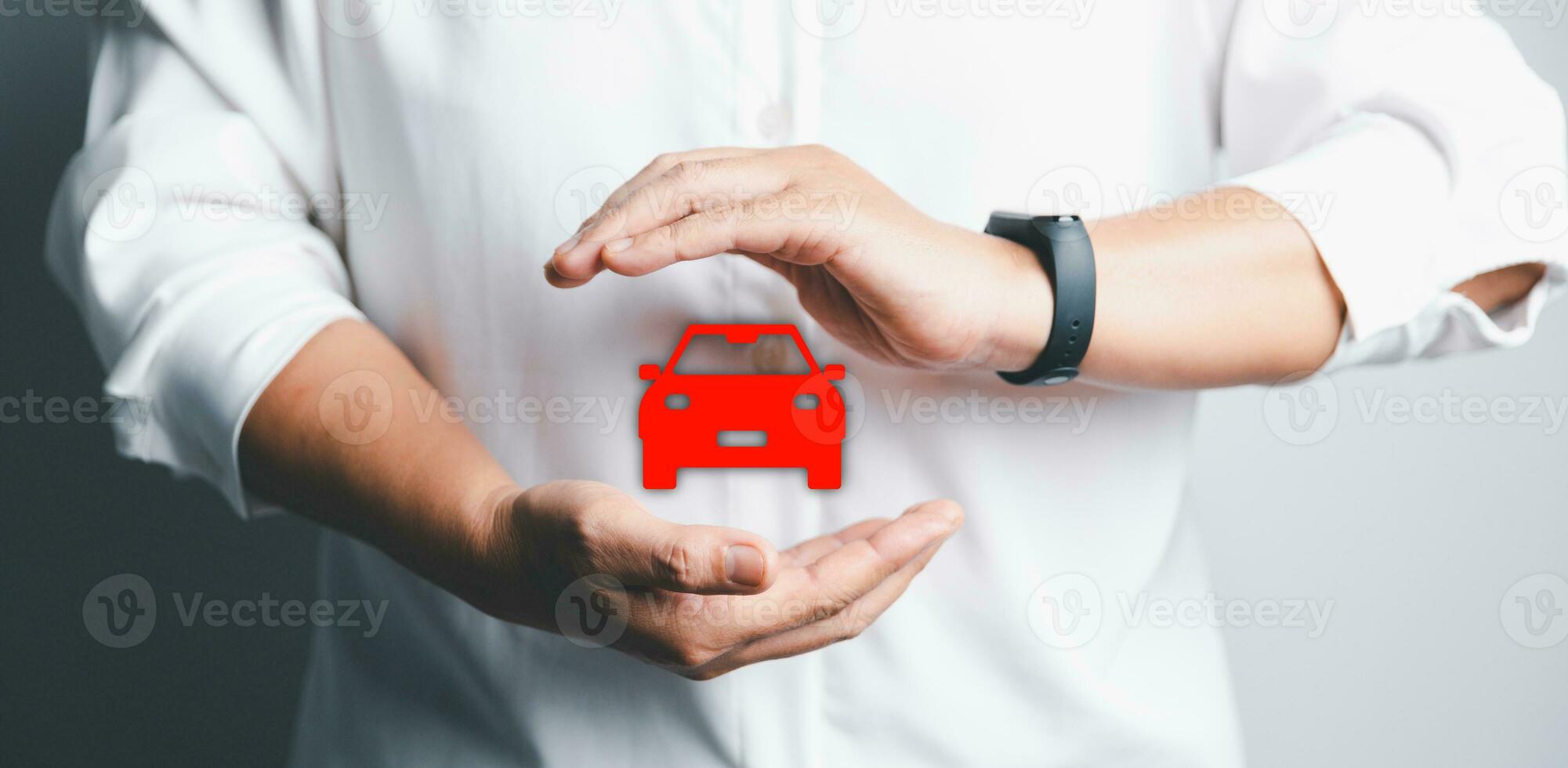 Business woman's hand protecting red icon car on desk. Planning to manage transportation finance costs. Concept of car insurance business, saving buy - sale with tax and loan for new car. photo