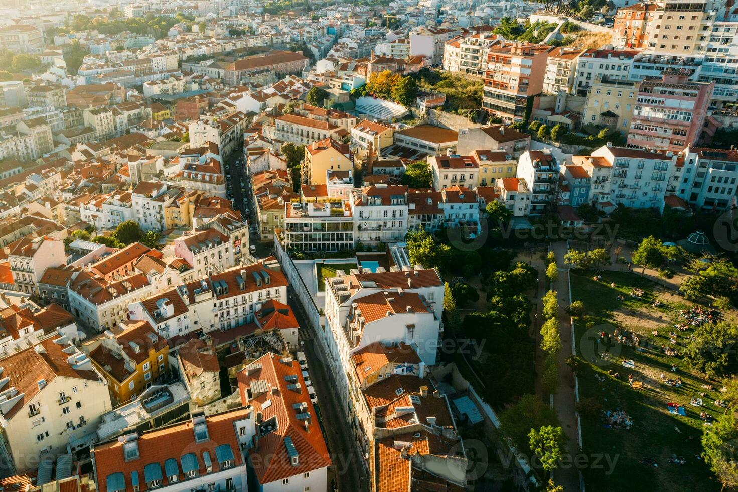 Aerial drone view of apeople at two viewpoints overlooking Lisbon, Portugal at sunset photo