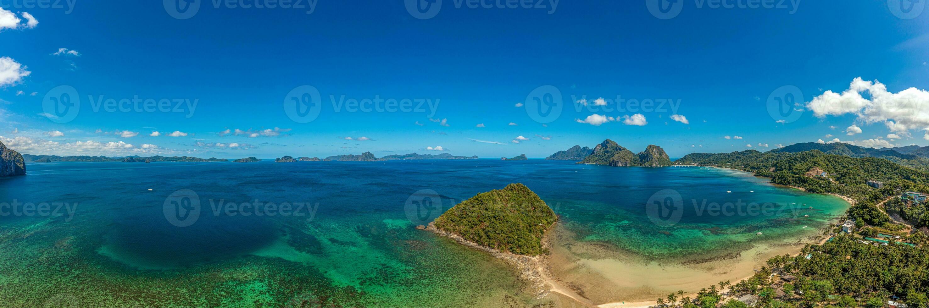 Drone panorama of the paradisiacal Maremegmeg beach near El Nido on the Philippine island of Palawan during the day photo