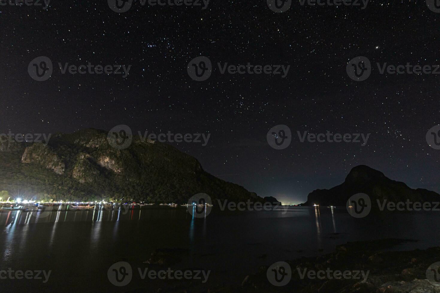 Night shot over the harbor and bay of El Nido on the island of Palawan photo