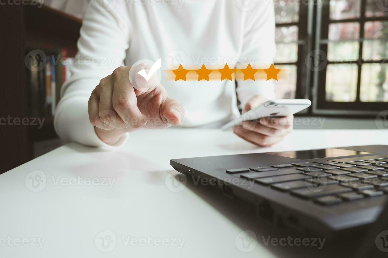 Customer satisfaction rating with smartphone, Thumbs up excellent service, Review the highest rated 5 stars, Impressed very good service, the best attention, feedback from guest. photo