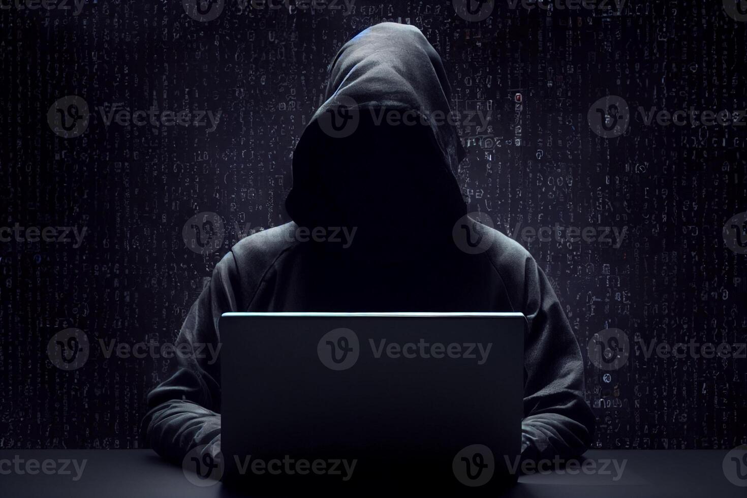Anonymous hacker without face typing computer laptop. Concept of hacking cybersecurity, cybercrime, cyberattack, etc. photo