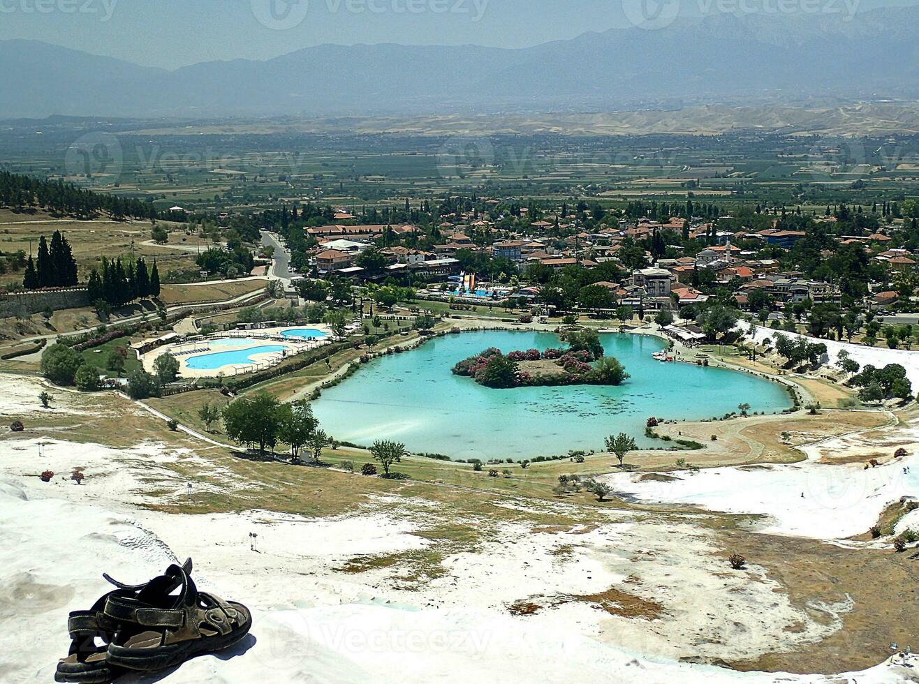 original Pamukkale place in Turkey in Asia landscape with limestone pools with blue warm water photo