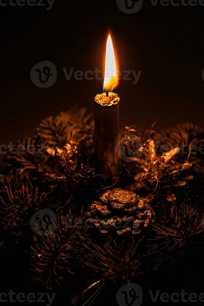 elegant Christmas headdress with a candle lit in the ambient lighting photo