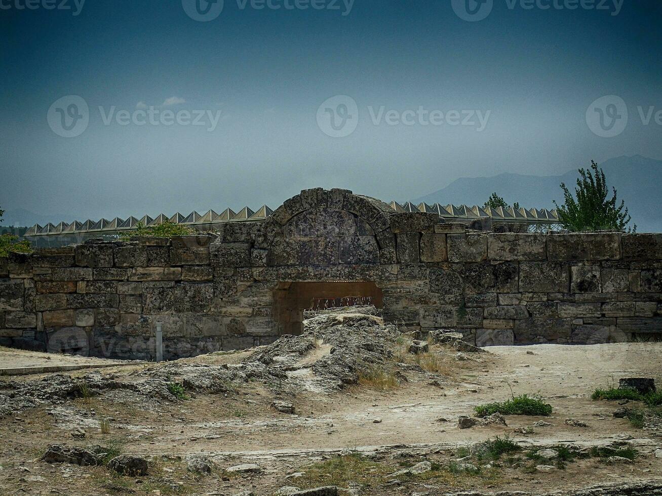 old ruins of the Roman spa city of Hierapolis on the site of the current poison on a warm summer sunny day photo
