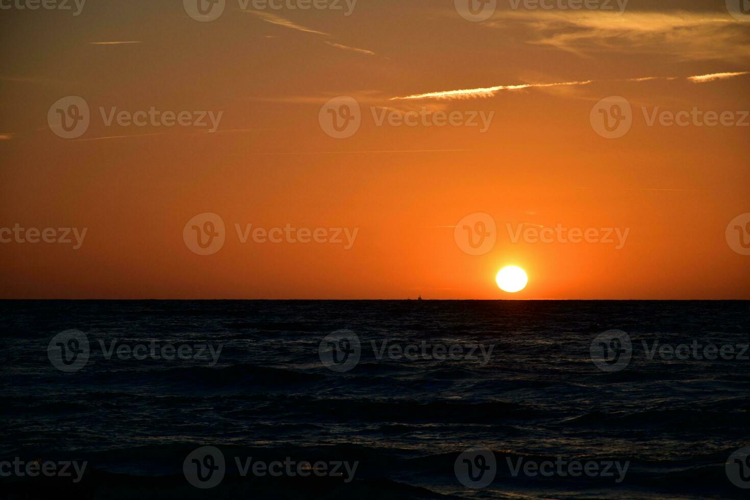 orange sunset on the beach of the Baltic Sea in Poland photo
